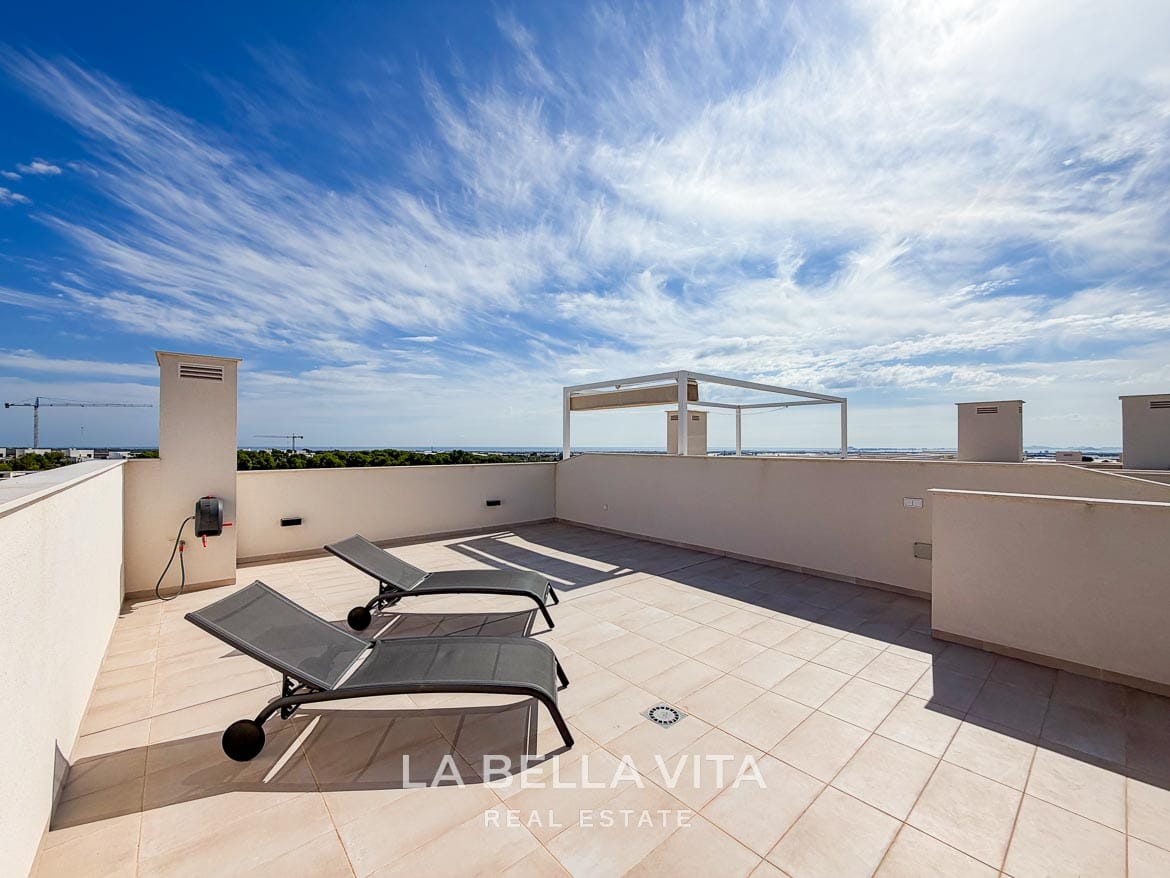 Modern Resale Apartment fot sale in Lo Romero Golf, Pilar de la Horadada, Alicante-36 Spacious tiled roof solarium with two sun loungers and distant sea views