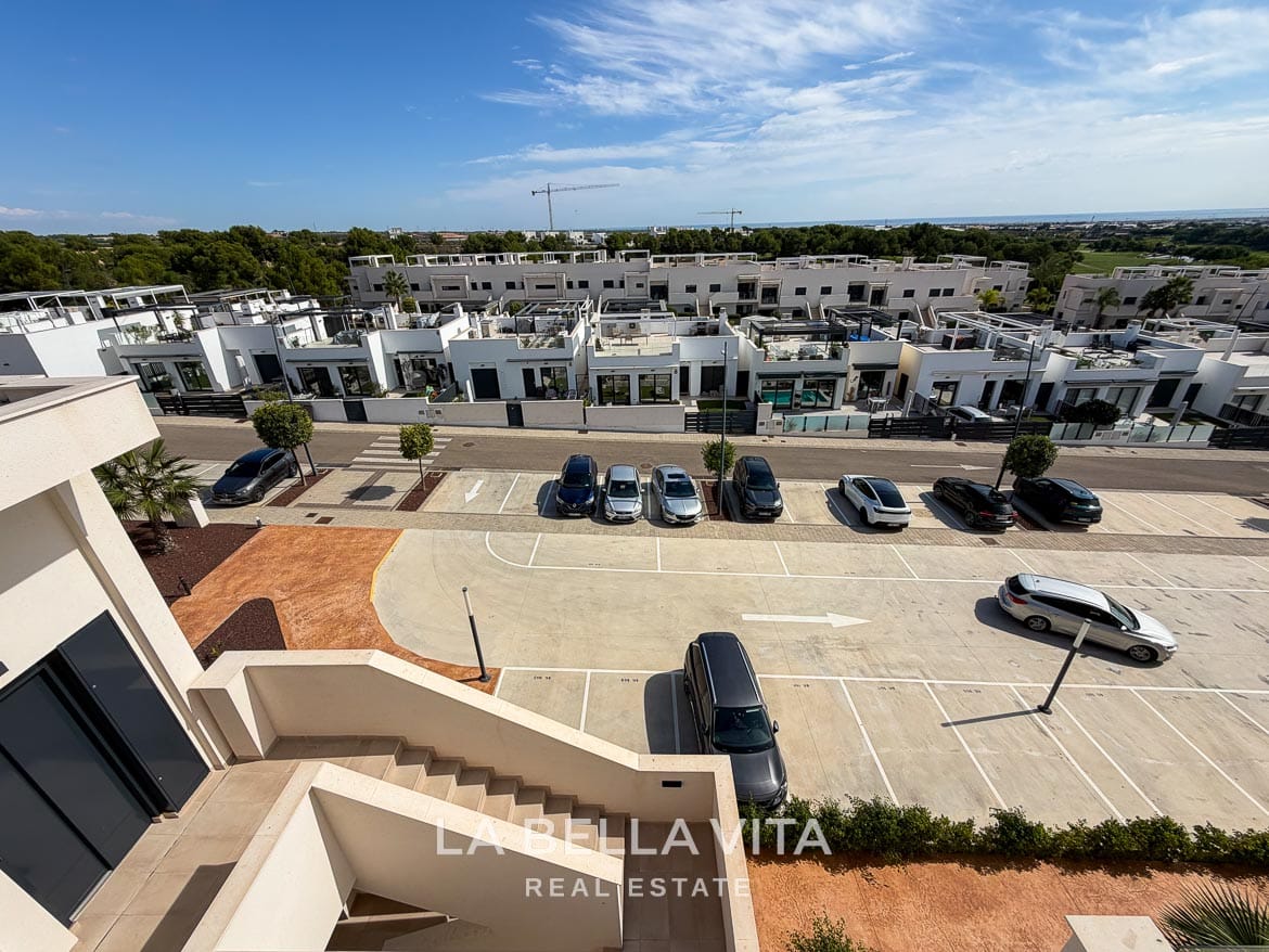 Modern Resale Apartment fot sale in Lo Romero Golf, Pilar de la Horadada, Alicante-42 Elevated view of the residential parking area, exterior access stairs and neighbouring homes