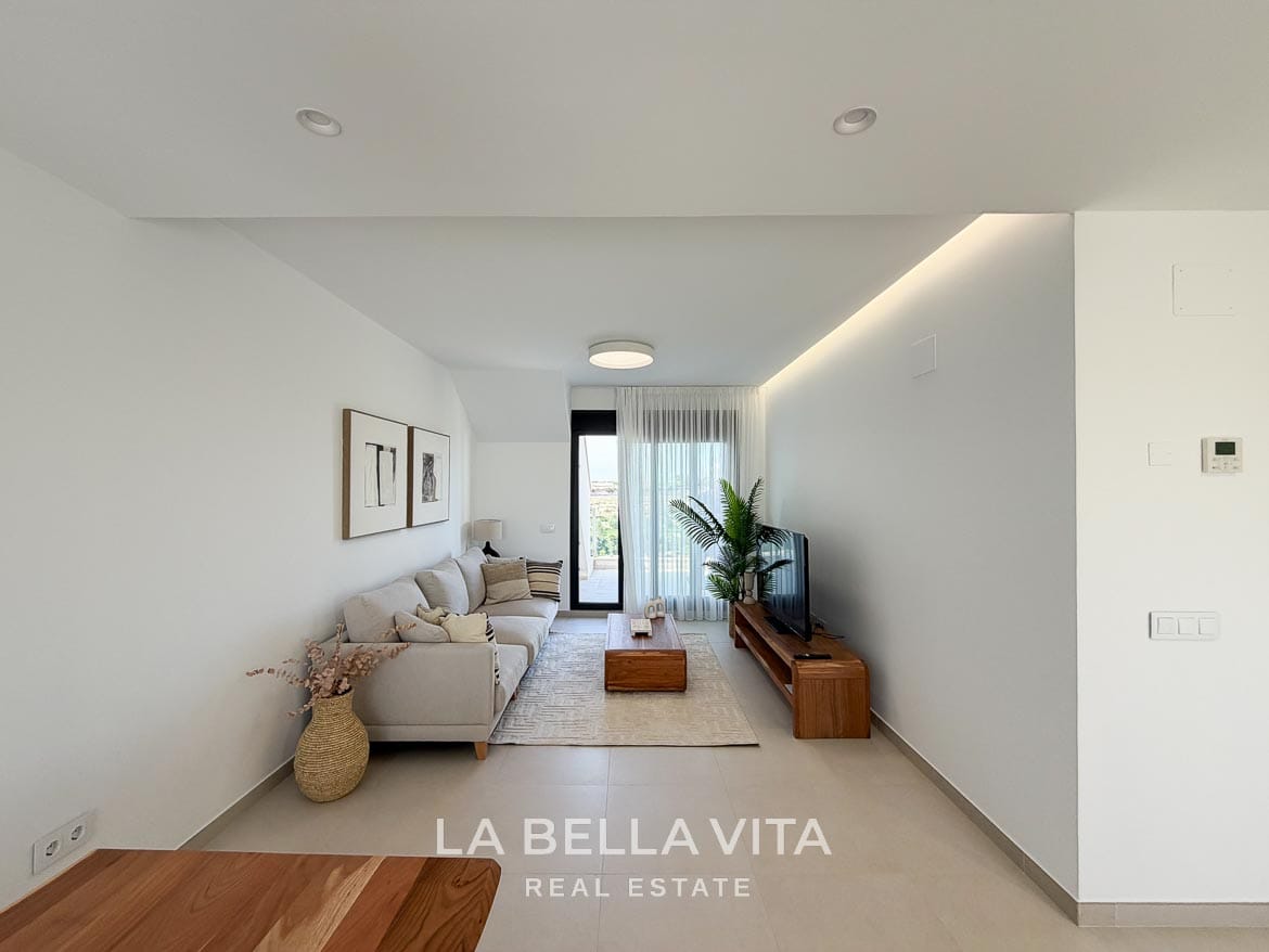 Modern Resale Apartment fot sale in Lo Romero Golf, Pilar de la Horadada, Alicante-9 Long view of the lounge with neutral furnishings, concealed ceiling lighting and terrace access