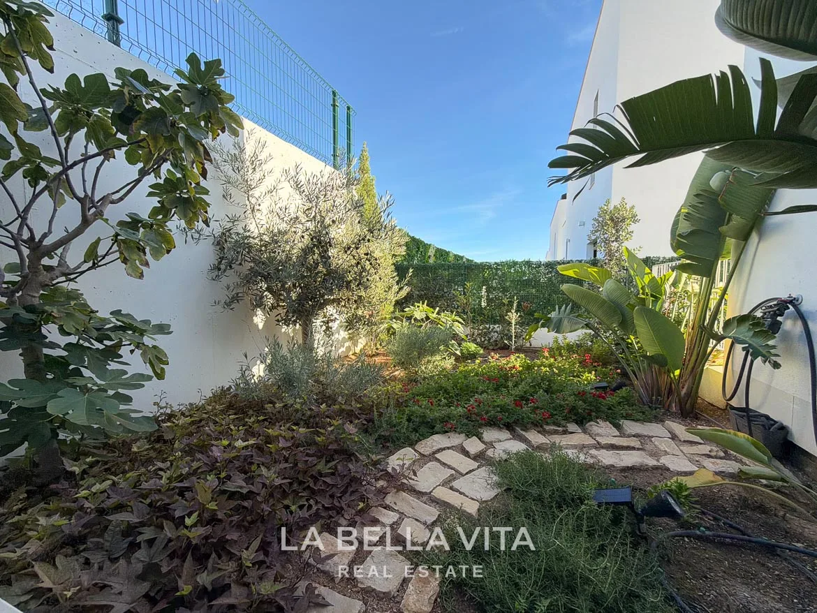 Modern Resale Villa with Basement and Private Pool for Sale in Finestrat-11 Landscaped garden corner with stepping stones, shrubs and trees in Finestrat, Alicante.