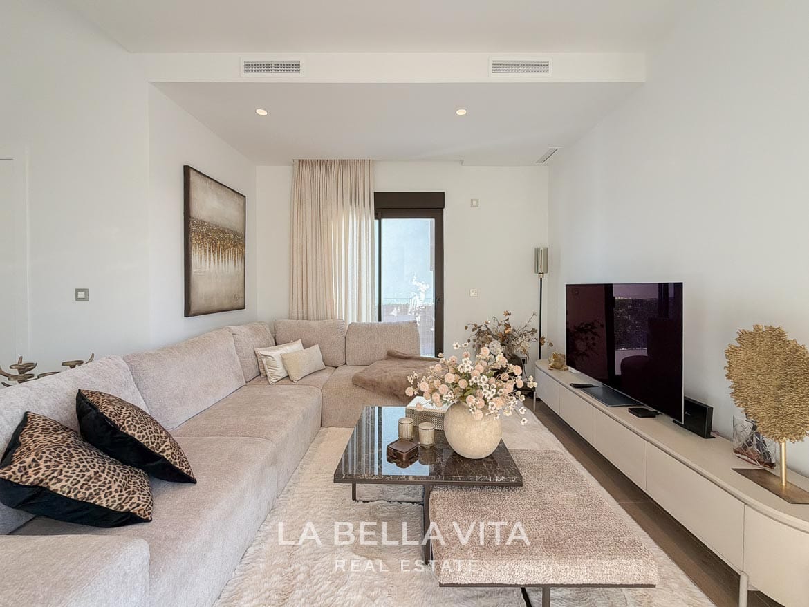 Modern Resale Villa with Basement and Private Pool for Sale in Finestrat-25 Living room seating arranged around a coffee table opposite the television in Finestrat, Alicante.