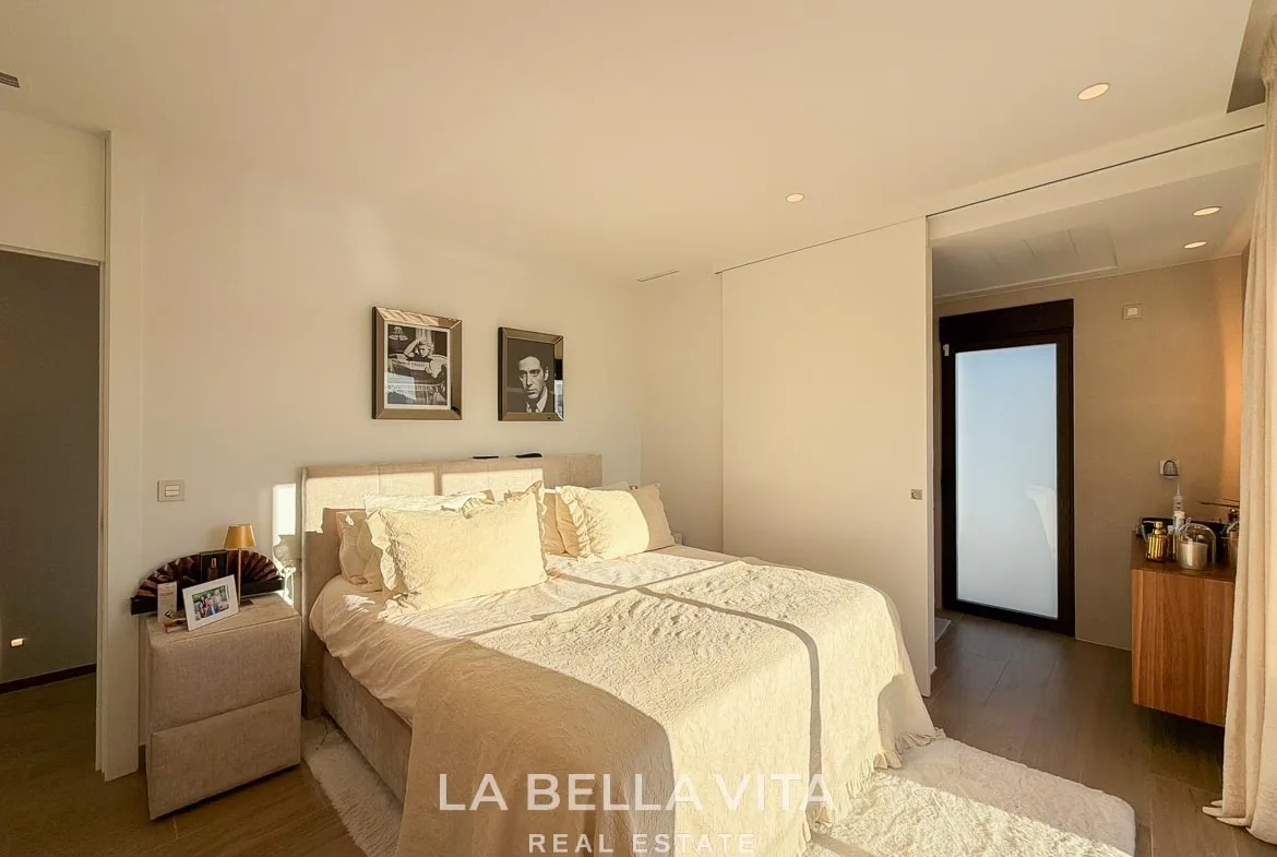 Double bedroom with a view through the open partition into the en-suite bathroom in Finestrat, Alicante.