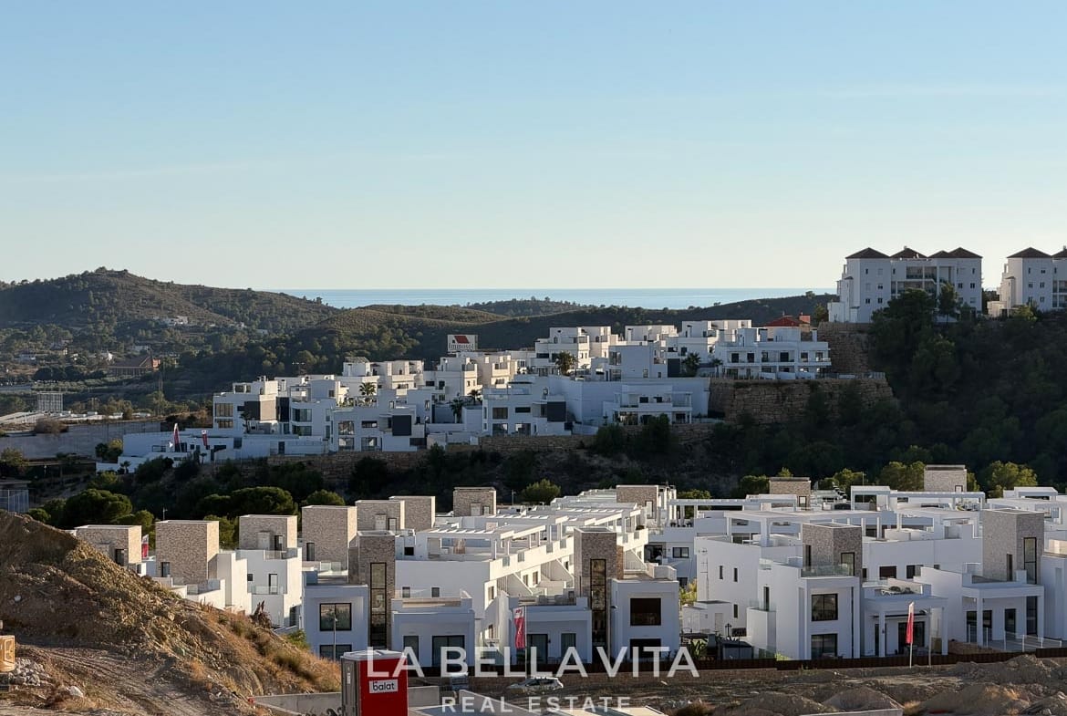 View over surrounding homes and hills towards the distant sea in Finestrat, Alicante.