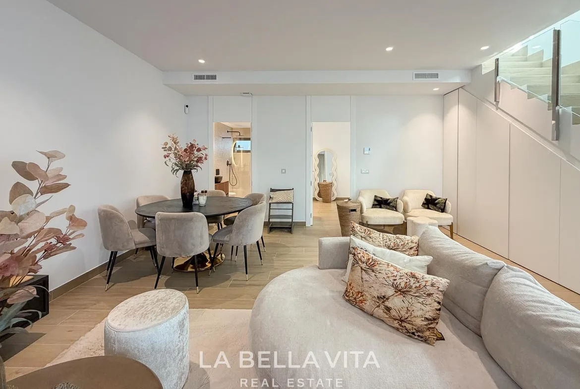 Basement lounge looking towards the dining table and adjoining rooms in Finestrat, Alicante.