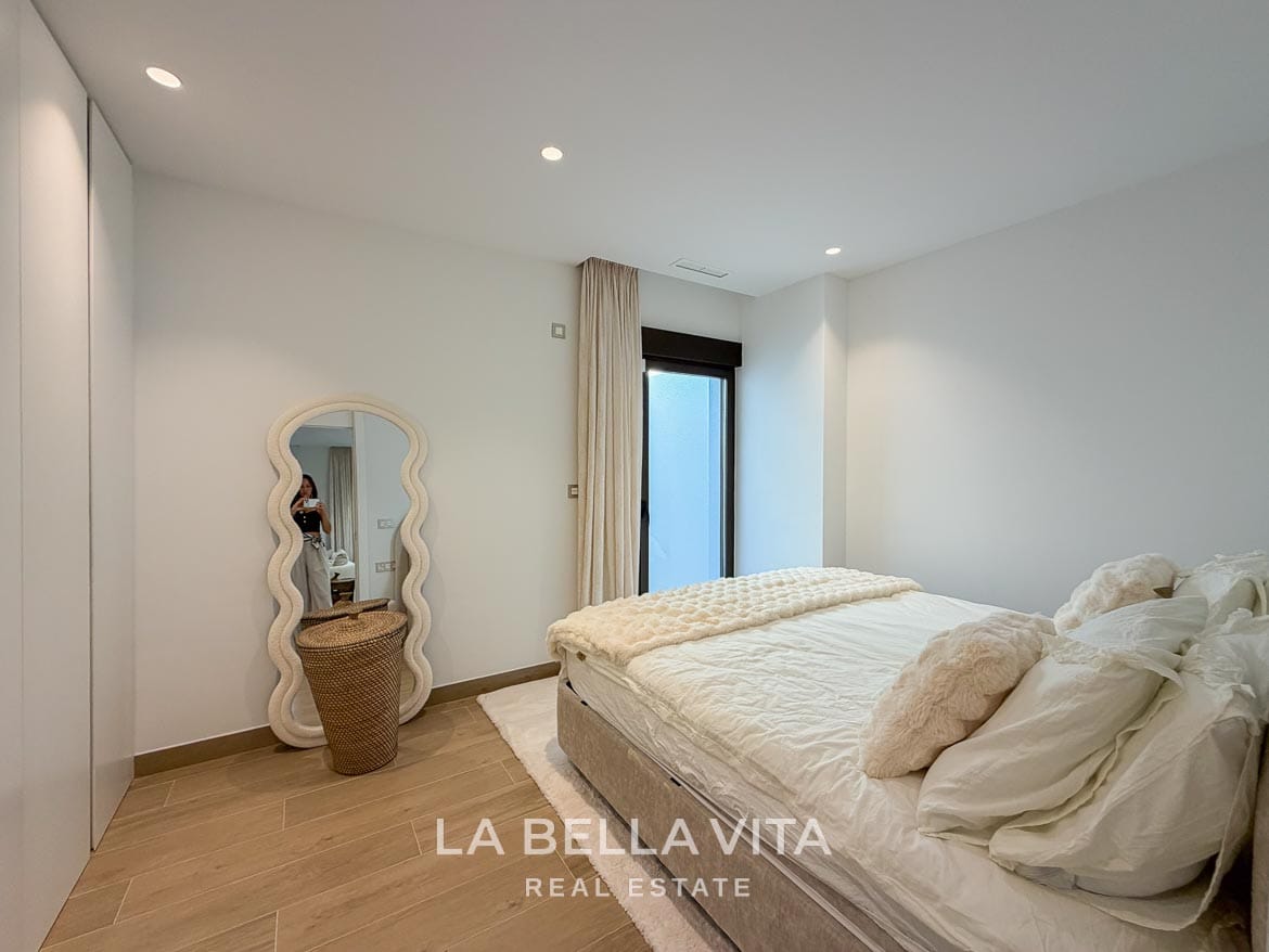 Modern Resale Villa with Basement and Private Pool for Sale in Finestrat-49 Basement double bedroom with fitted wardrobes and a full-length mirror in Finestrat, Alicante.