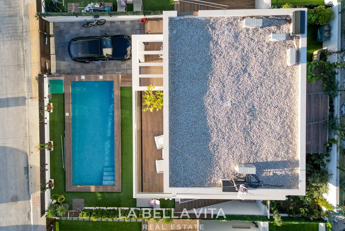 Overhead view of the villa roof, private pool, garden and parking area in Finestrat, Alicante.