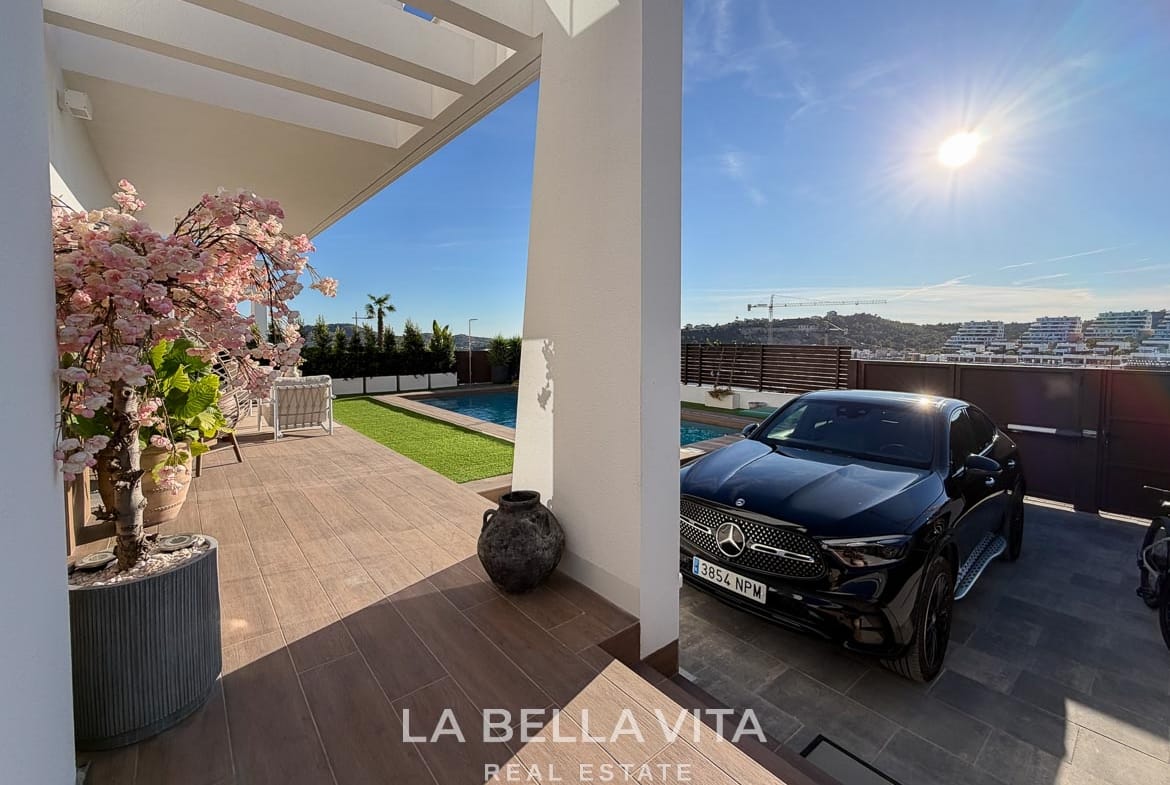 Private driveway beside the villa entrance, terrace and pool in Finestrat, Alicante.