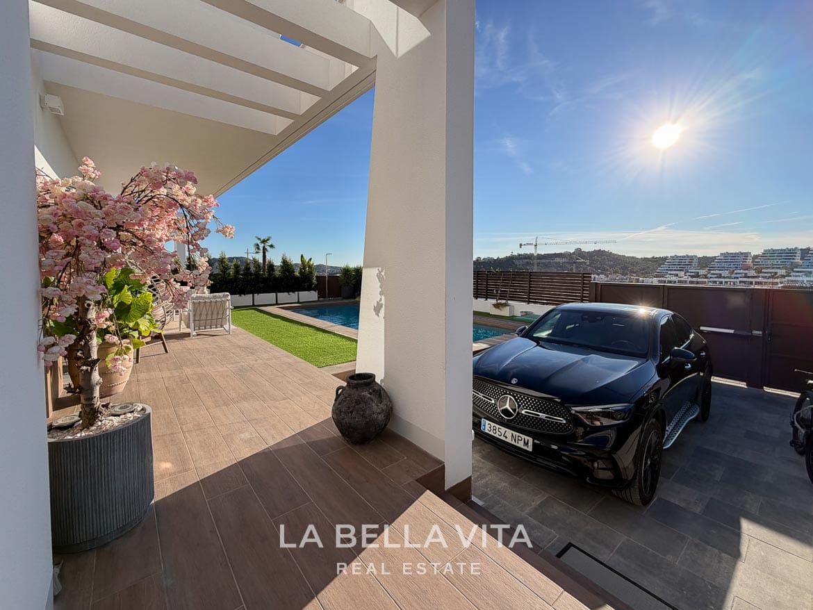 Modern Resale Villa with Basement and Private Pool for Sale in Finestrat-8 Private driveway beside the villa entrance, terrace and pool in Finestrat, Alicante.