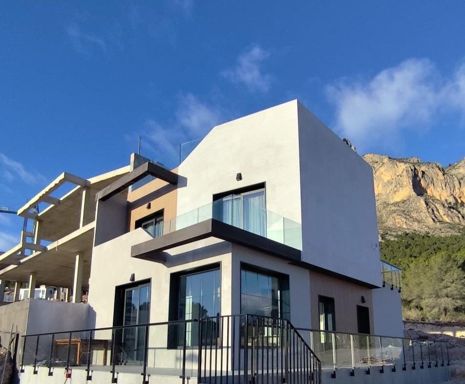 Exterior of a show home with terraces and mountain surroundings in Polop, Alicante