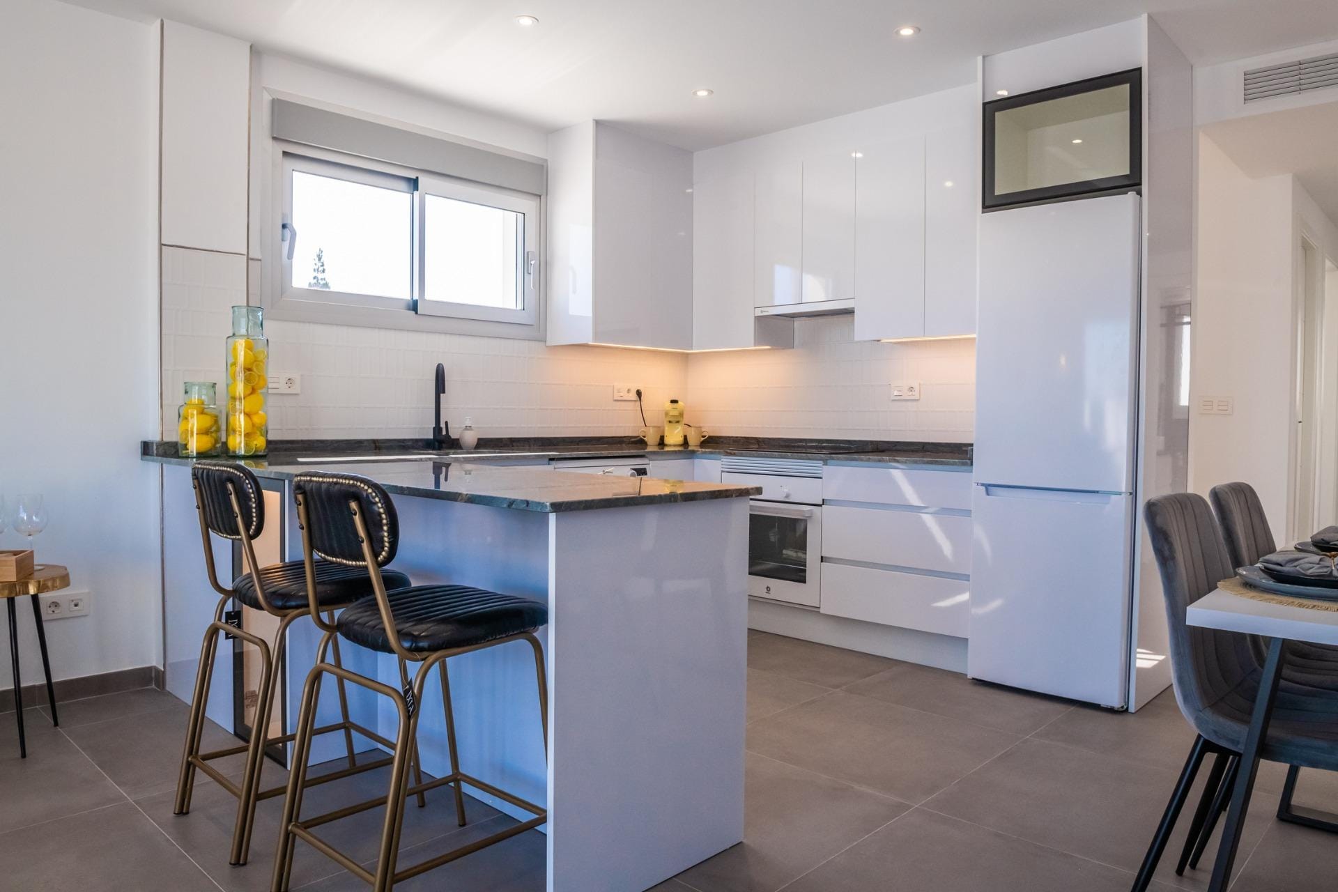 Kitchen with a breakfast bar and white cabinets in Torre del Rame, Los Alcázares, Murcia