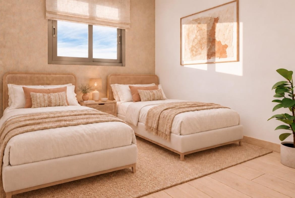 Twin bedroom with cane headboards and wall art in Santa Pola, Alicante