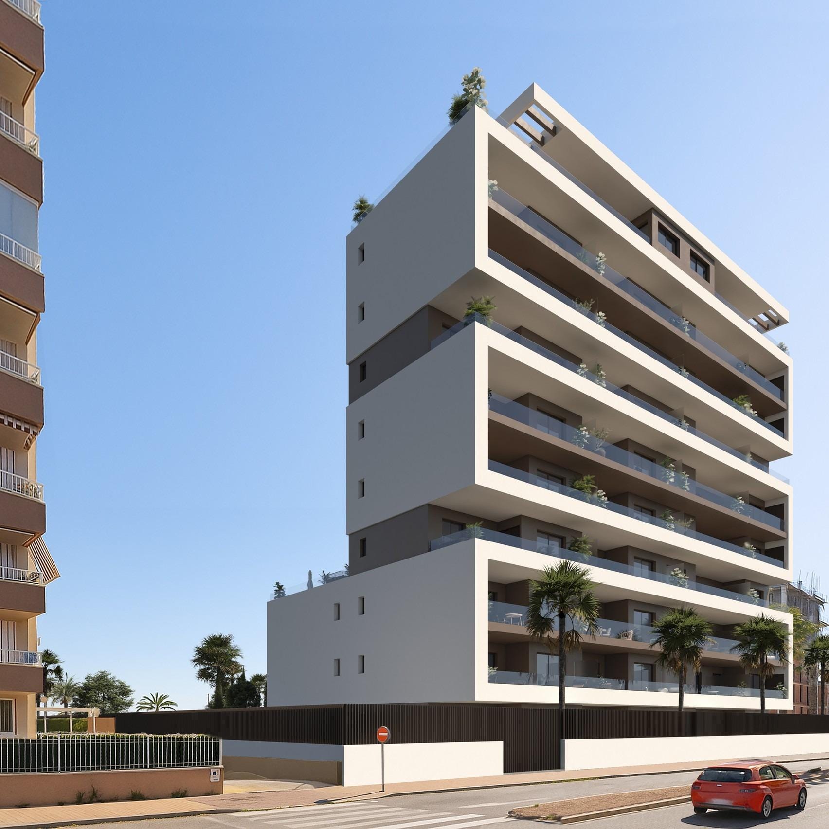 New-Build-Apartments-in-Guardamar-del-Segura-1 Contemporary apartment building with broad balconies and palms beside the street in Guardamar del Segura, Alicante