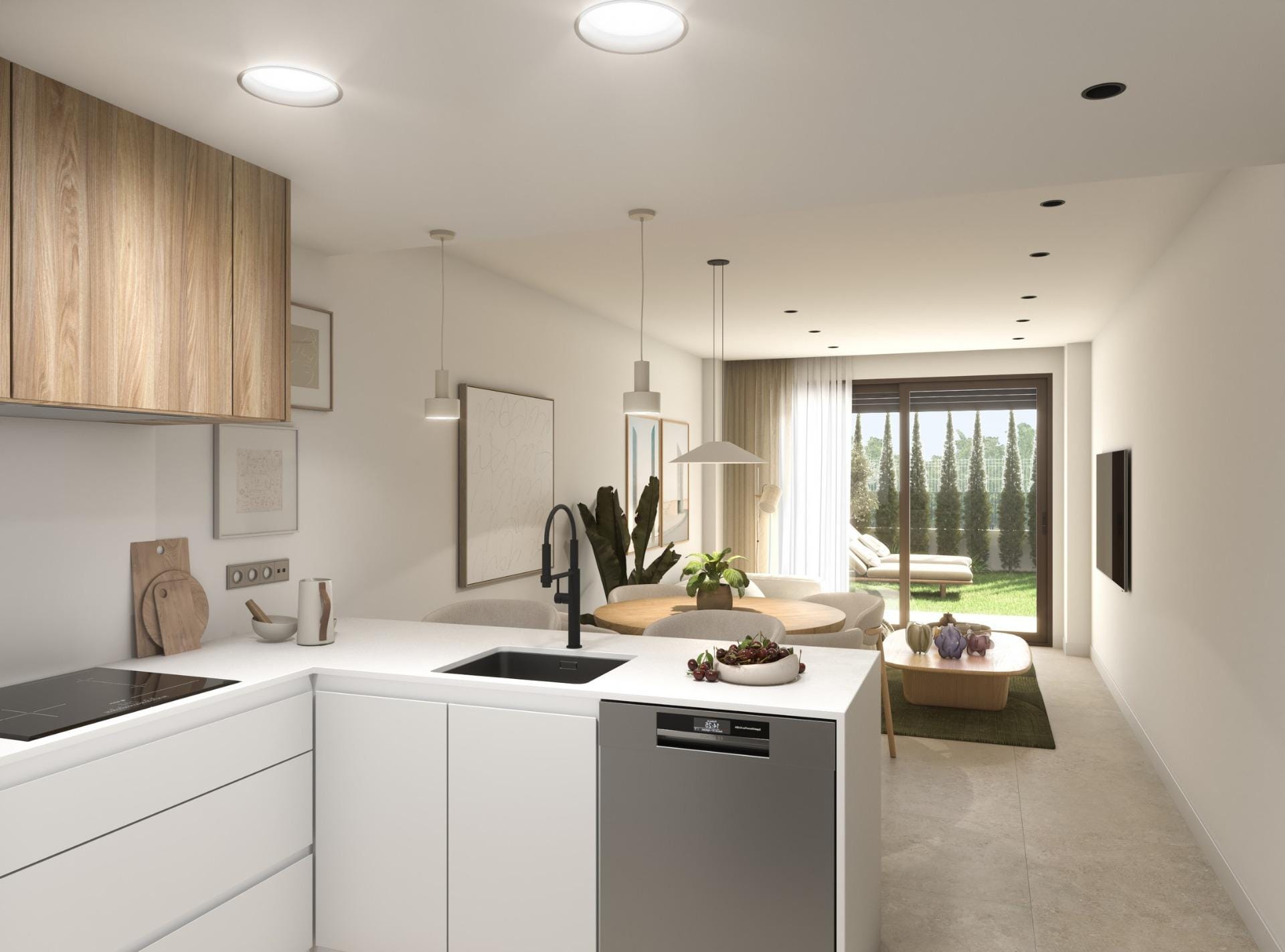 New-Build-Apartments-in-Guardamar-del-Segura-4 White kitchen with a black sink looking towards the dining area, living room and garden in Guardamar del Segura, Alicante
