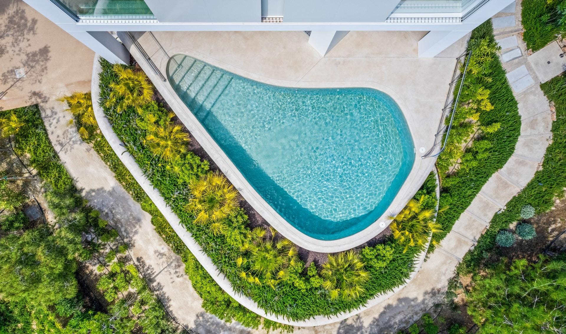 New-build-luxury-villas-at-Las-Colinas-Golf-and-Country-Club-2 Aerial view of a private pool and landscaped terrace at Las Colinas Golf, Orihuela, Alicante