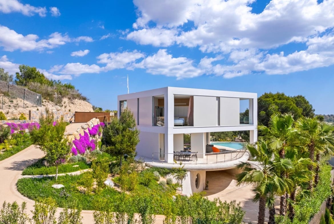 Villa exterior with landscaped garden and terrace at Las Colinas Golf, Orihuela, Alicante