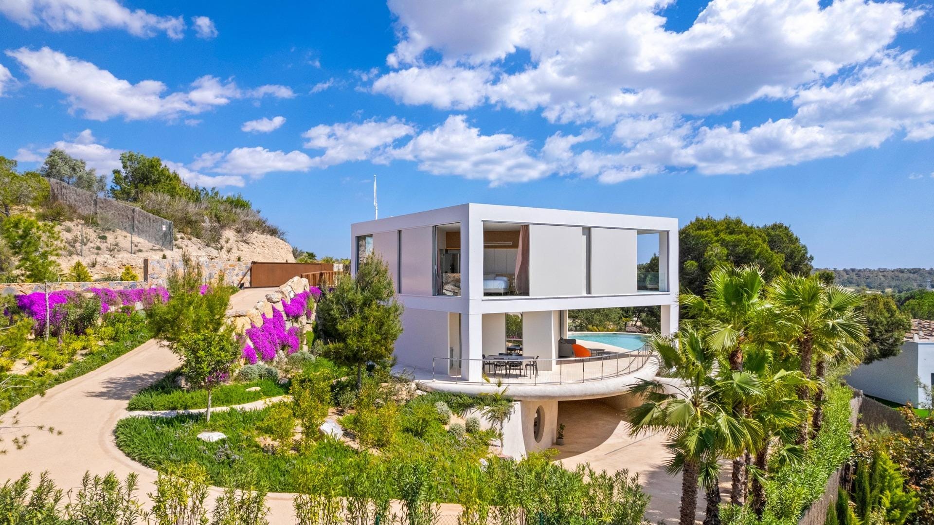 New-build-luxury-villas-at-Las-Colinas-Golf-and-Country-Club-3 Villa exterior with landscaped garden and terrace at Las Colinas Golf, Orihuela, Alicante