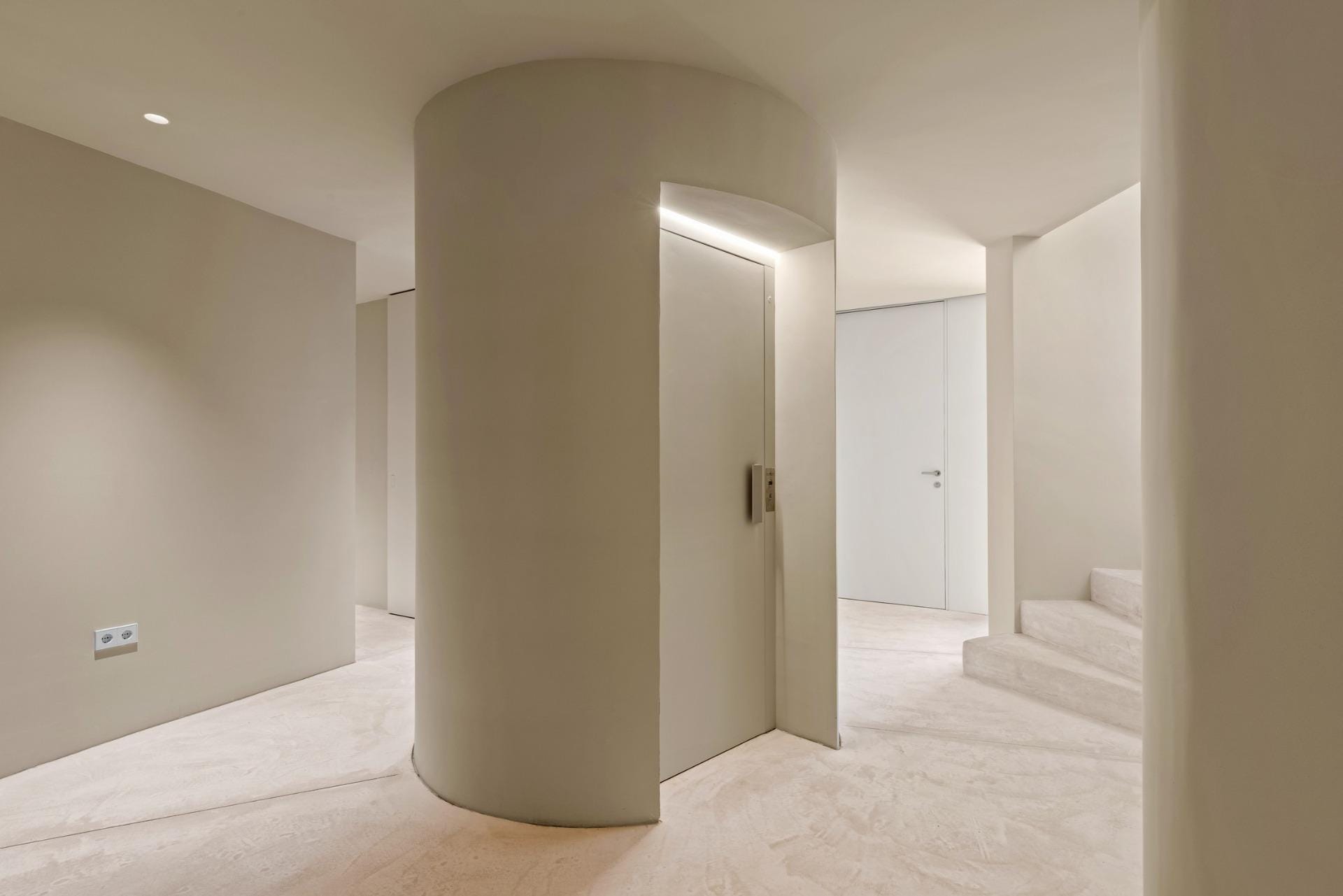 New-build-luxury-villas-at-Las-Colinas-Golf-and-Country-Club-7 Interior hallway with staircase and lift door at Las Colinas Golf, Orihuela, Alicante