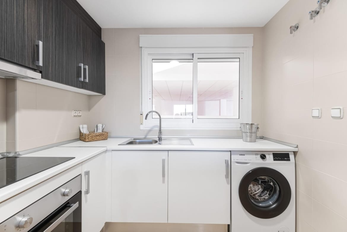 Kitchen with appliances and washing machine in Lomas de Cabo Roig, Alicante