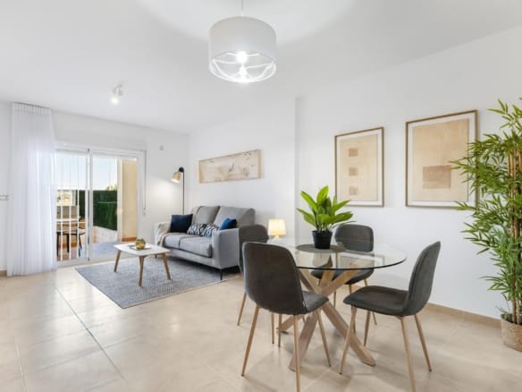 Furnished living and dining room with balcony doors in Lomas de Cabo Roig, Alicante