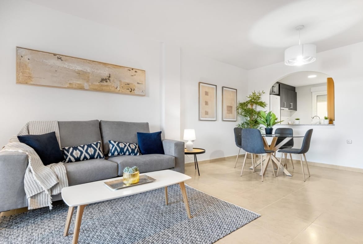 Living and dining room with sofa and coffee table in Lomas de Cabo Roig, Alicante