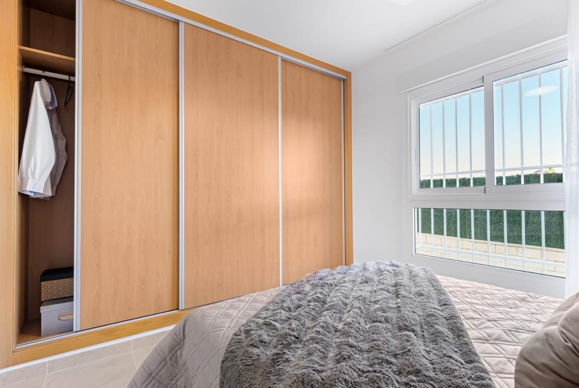 Fitted wardrobe beside a double bed in Lomas de Cabo Roig, Alicante