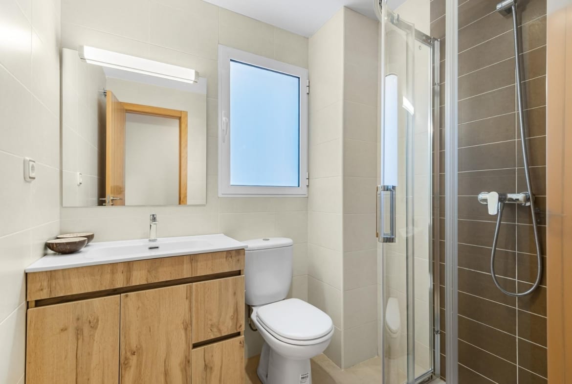 Bathroom with a vanity unit and glass shower enclosure in Lomas de Cabo Roig, Alicante