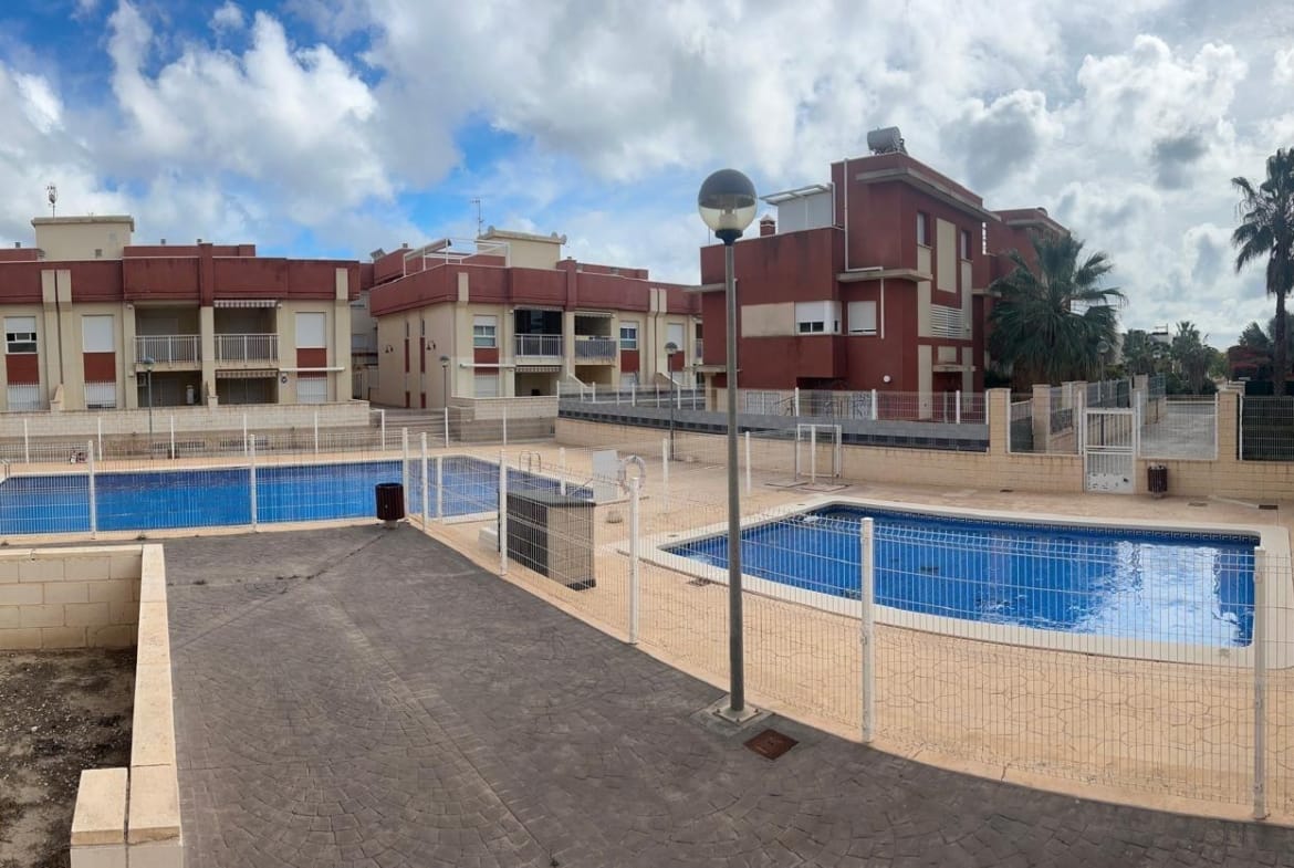 Communal swimming pools and surrounding terrace in Lomas de Cabo Roig, Alicante