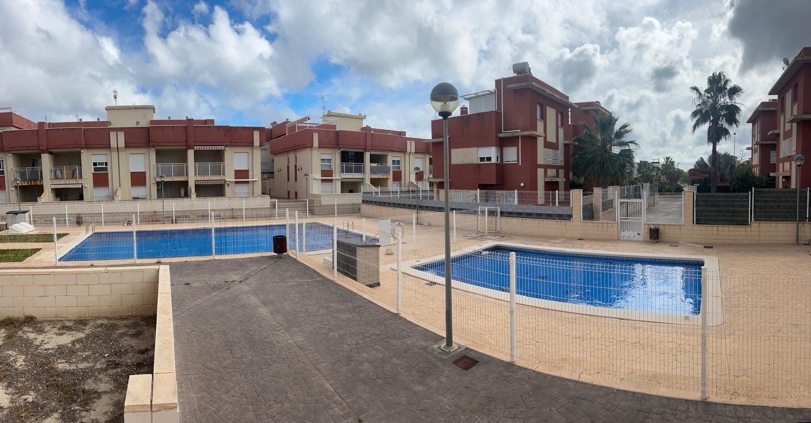 Regenerated Residential Complex in Lomas de Cabo Roig – Renovated Apartments Communal swimming pools and surrounding terrace in Lomas de Cabo Roig, Alicante